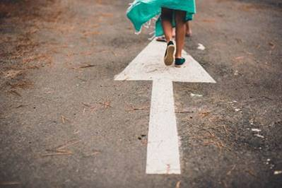 walking on arrow on road