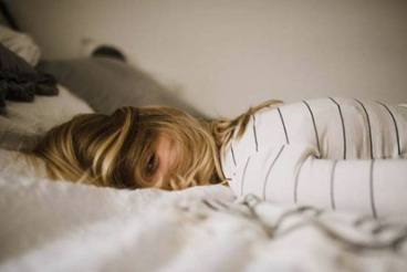 woman lying on bed