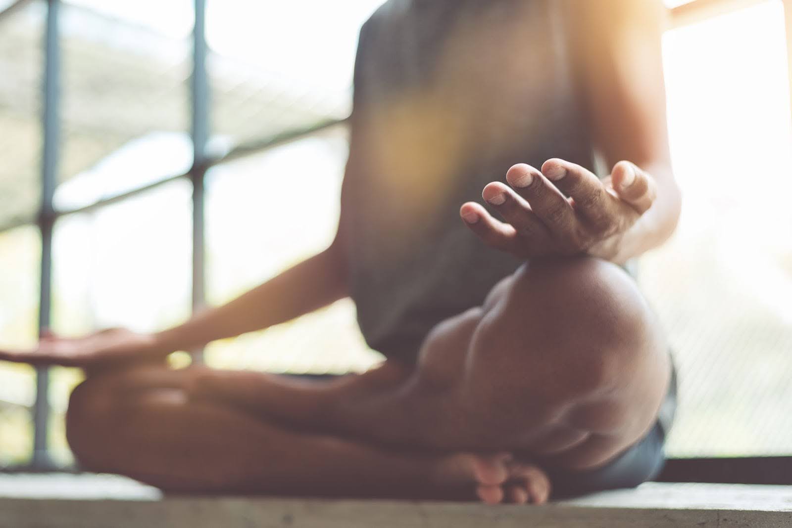 Closeup shot of a healthy, fit person in a yoga studio